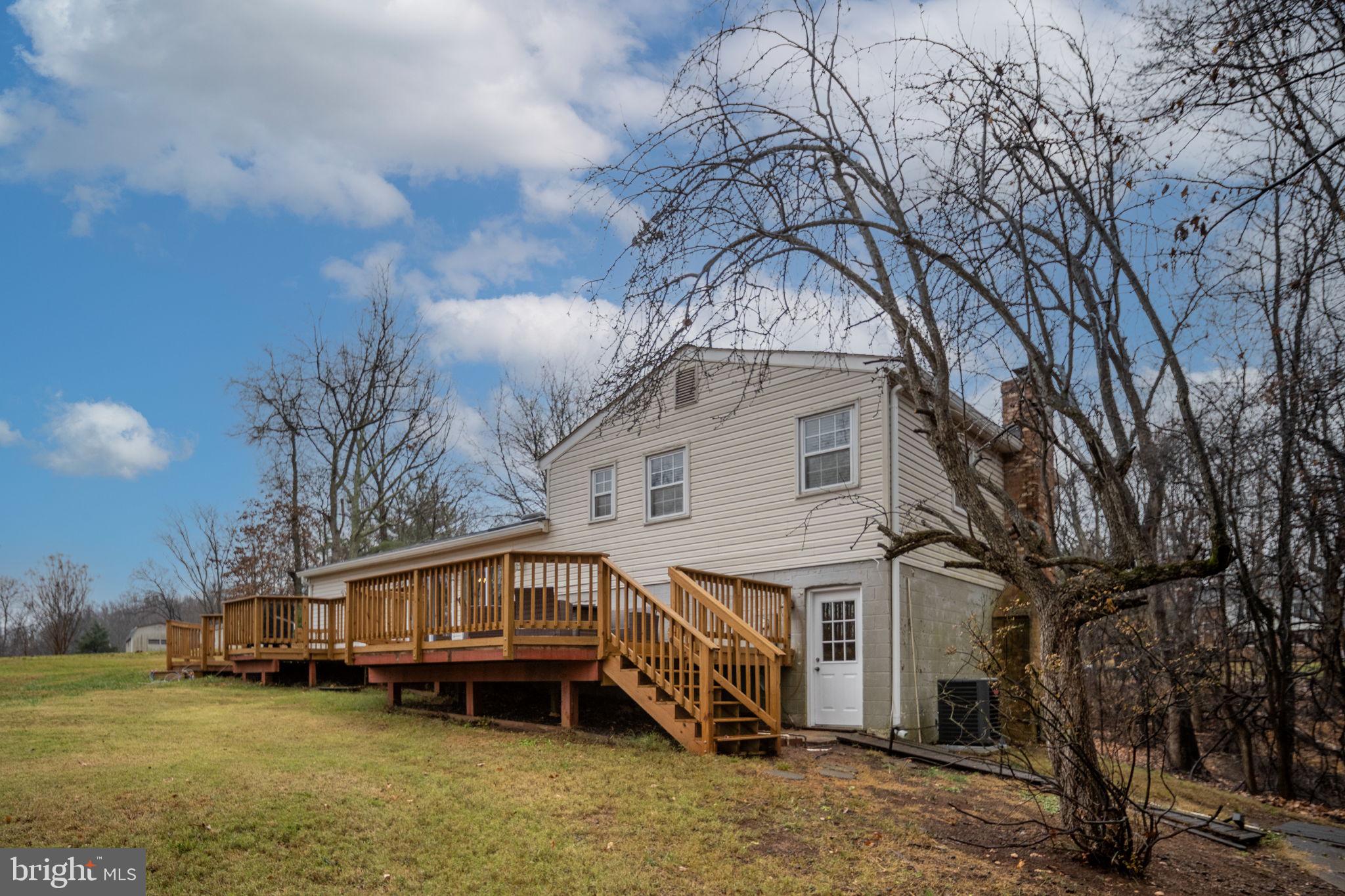 6765 Settlers Ridge Road Warrenton, VA 20187 - Photo 52 of 66 a front view of a house with a yard and balcony
