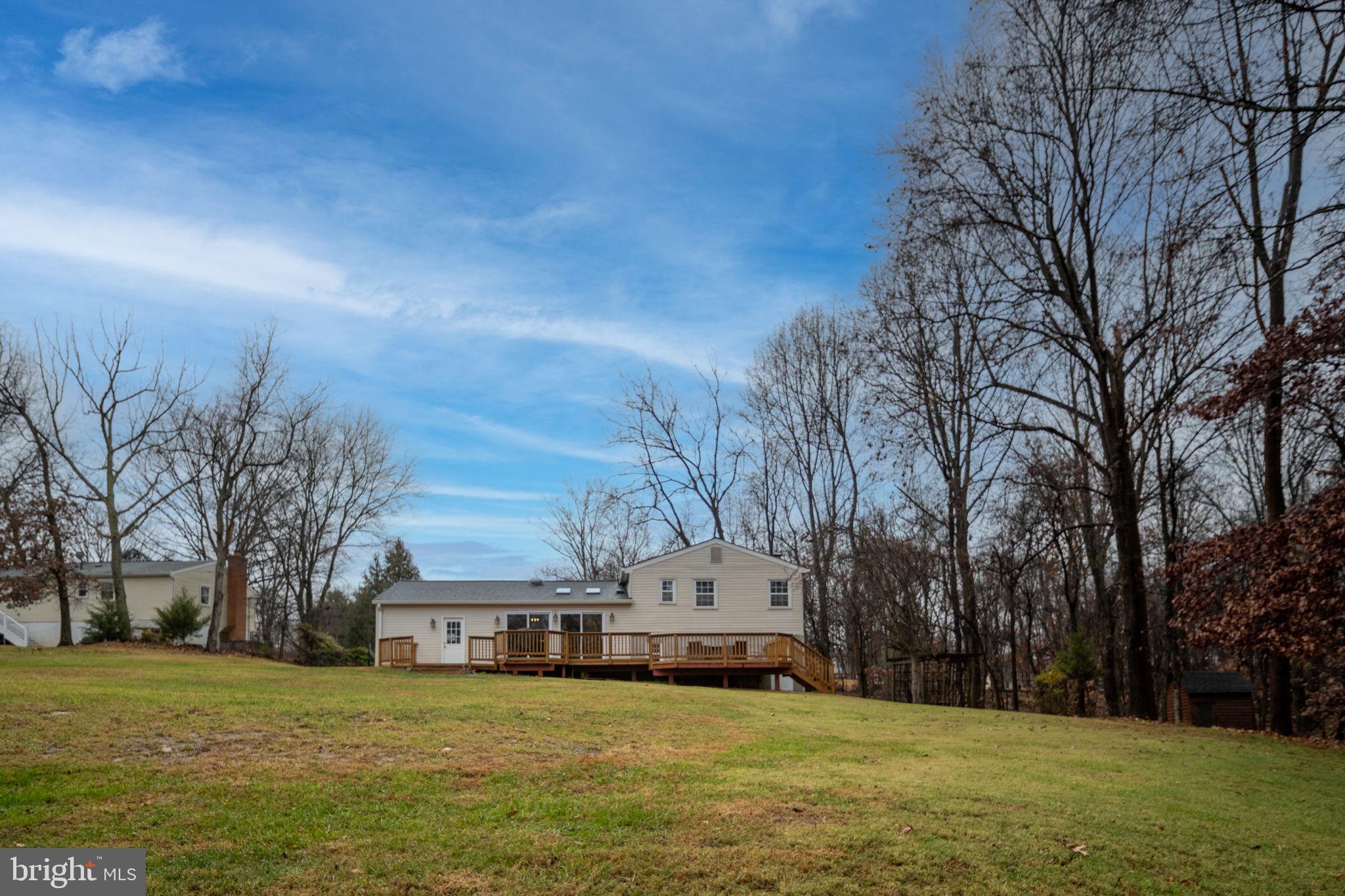 6765 Settlers Ridge Road Warrenton, VA 20187 - Photo 58 of 66 a view of a town with large trees and a big yard