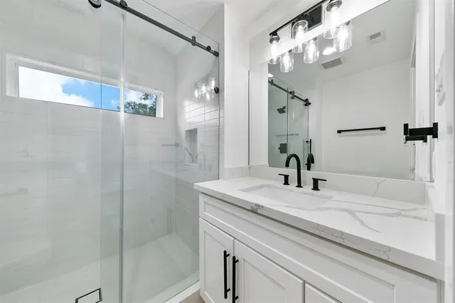 a view of road with large trees and playing ground