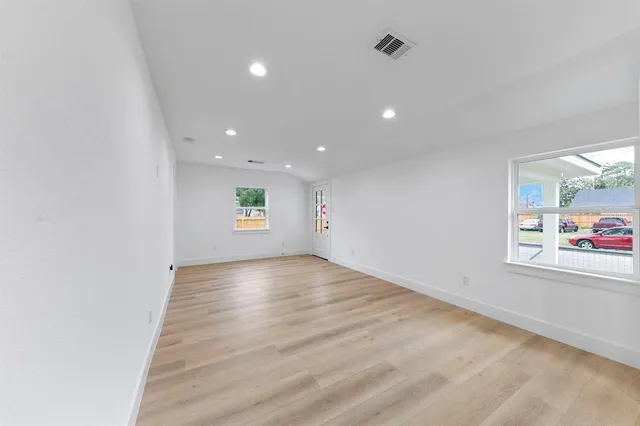 a kitchen that has a lot of cabinets in it