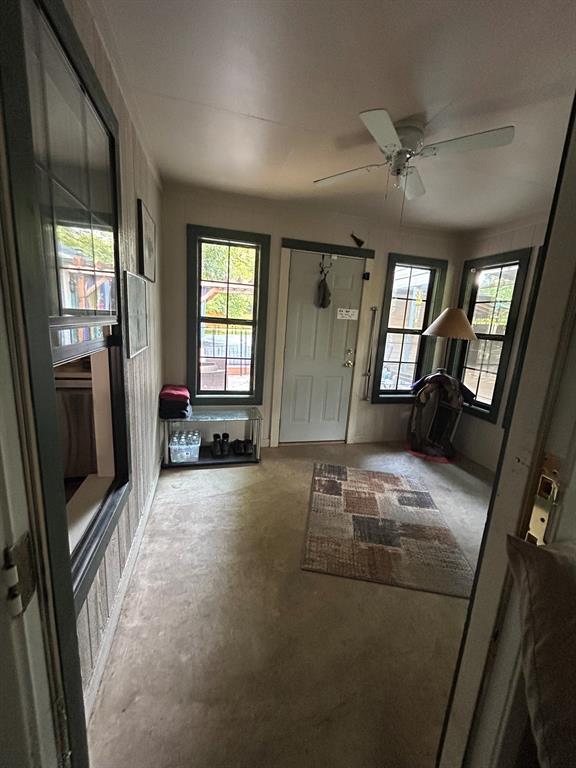 2275 Graham Street Paris, TX 75460 - Photo 15 of 21 Sunroom with plenty of natural light, concrete floors, and ceiling fan after clean out
