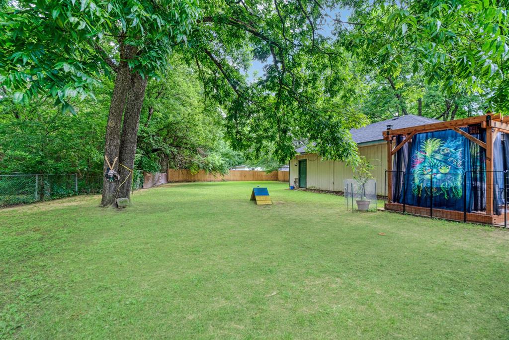 2275 Graham Street Paris, TX 75460 - Photo 16 of 21 View of fenced backyard and pergola