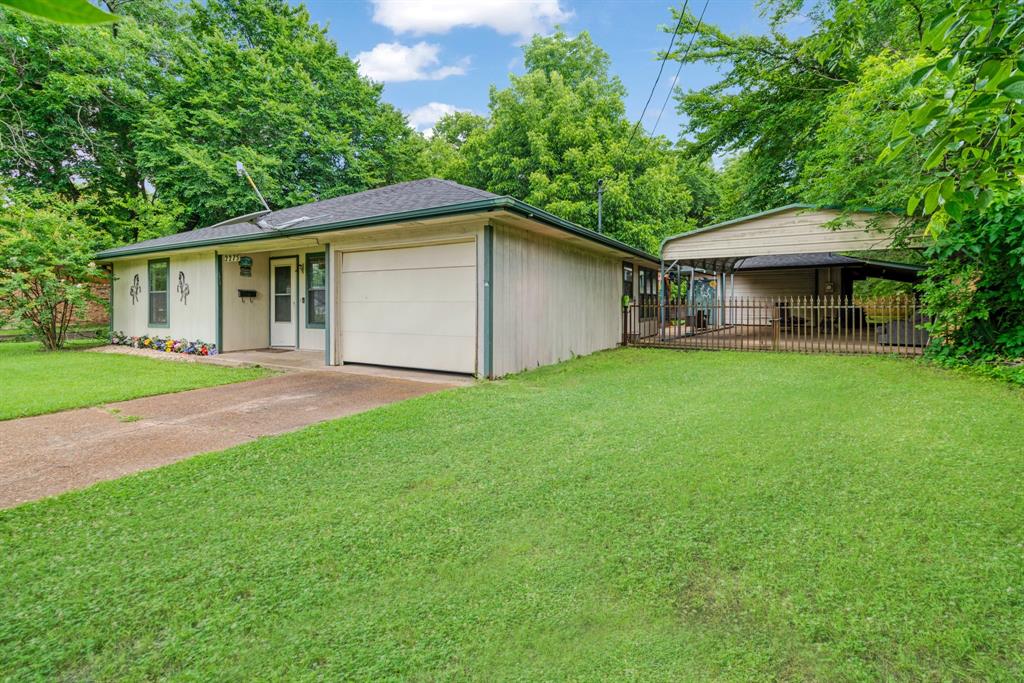 2275 Graham Street Paris, TX 75460 - Photo 2 of 21 View of front of house with concrete driveway and a garage