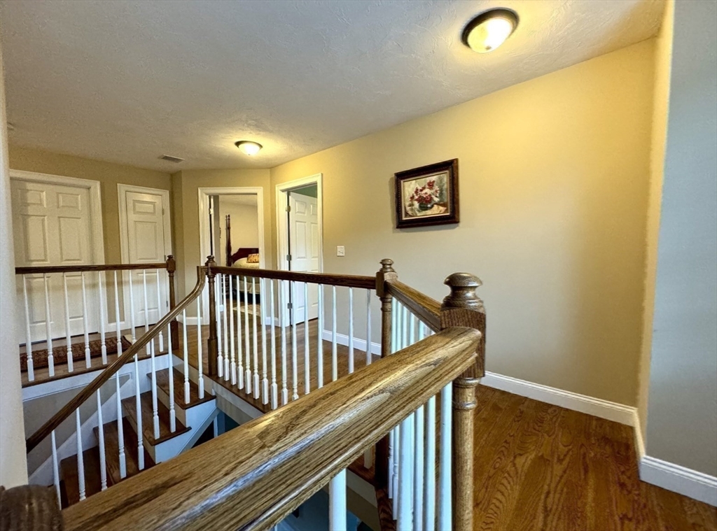34 Adams Road Grafton, MA 01519 - Photo 6 of 30 a view of staircase with railing and a window