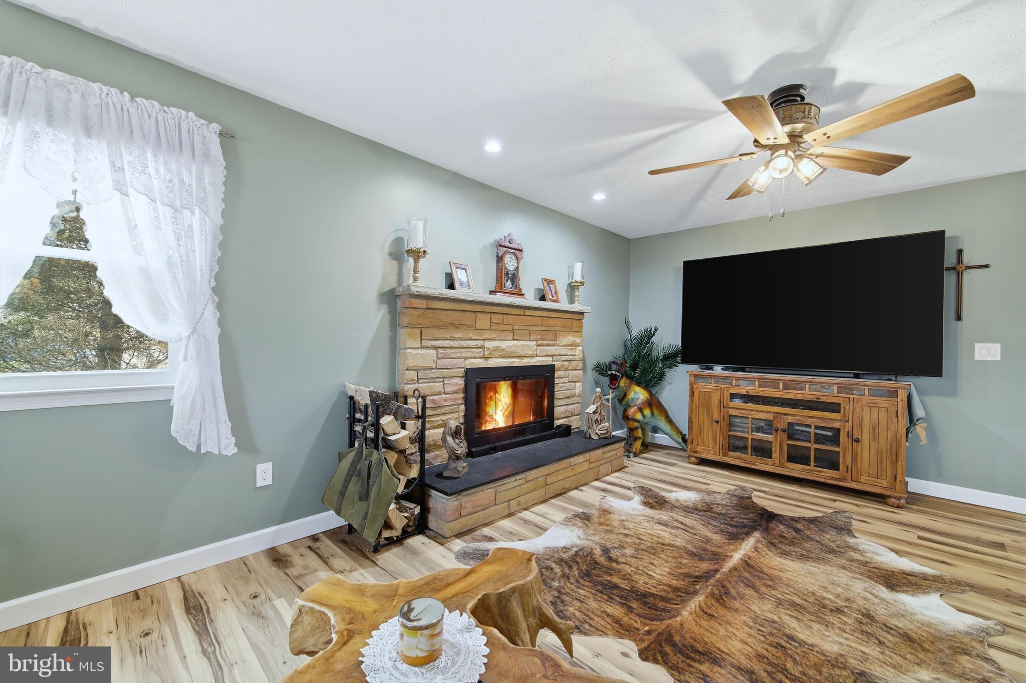 5911 Smith Creek Road New Market, VA 22844 - Photo 11 of 78 a living room with furniture and a flat screen tv