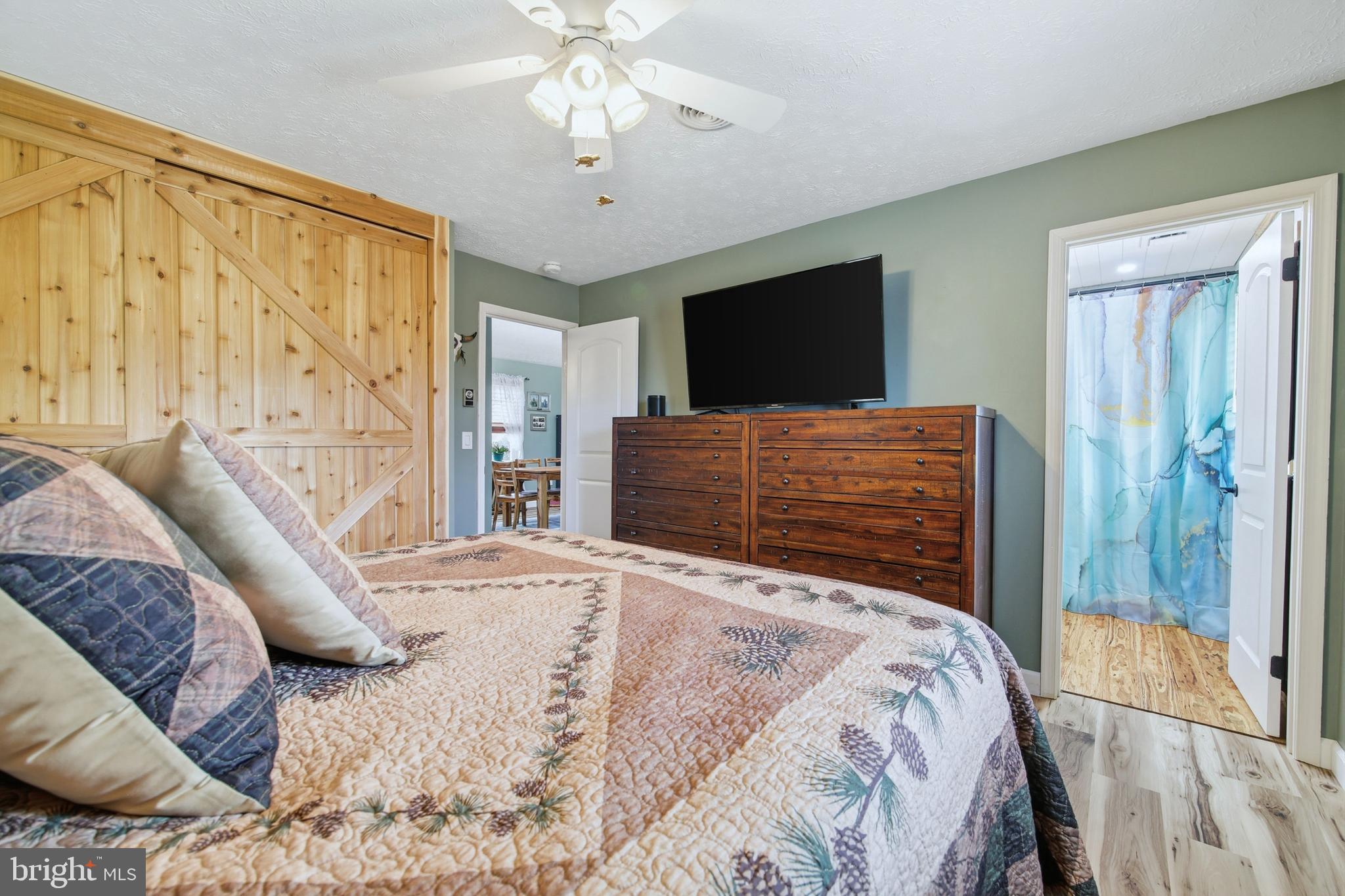 5911 Smith Creek Road New Market, VA 22844 - Photo 38 of 78 a bedroom with a bed and a flat screen tv
