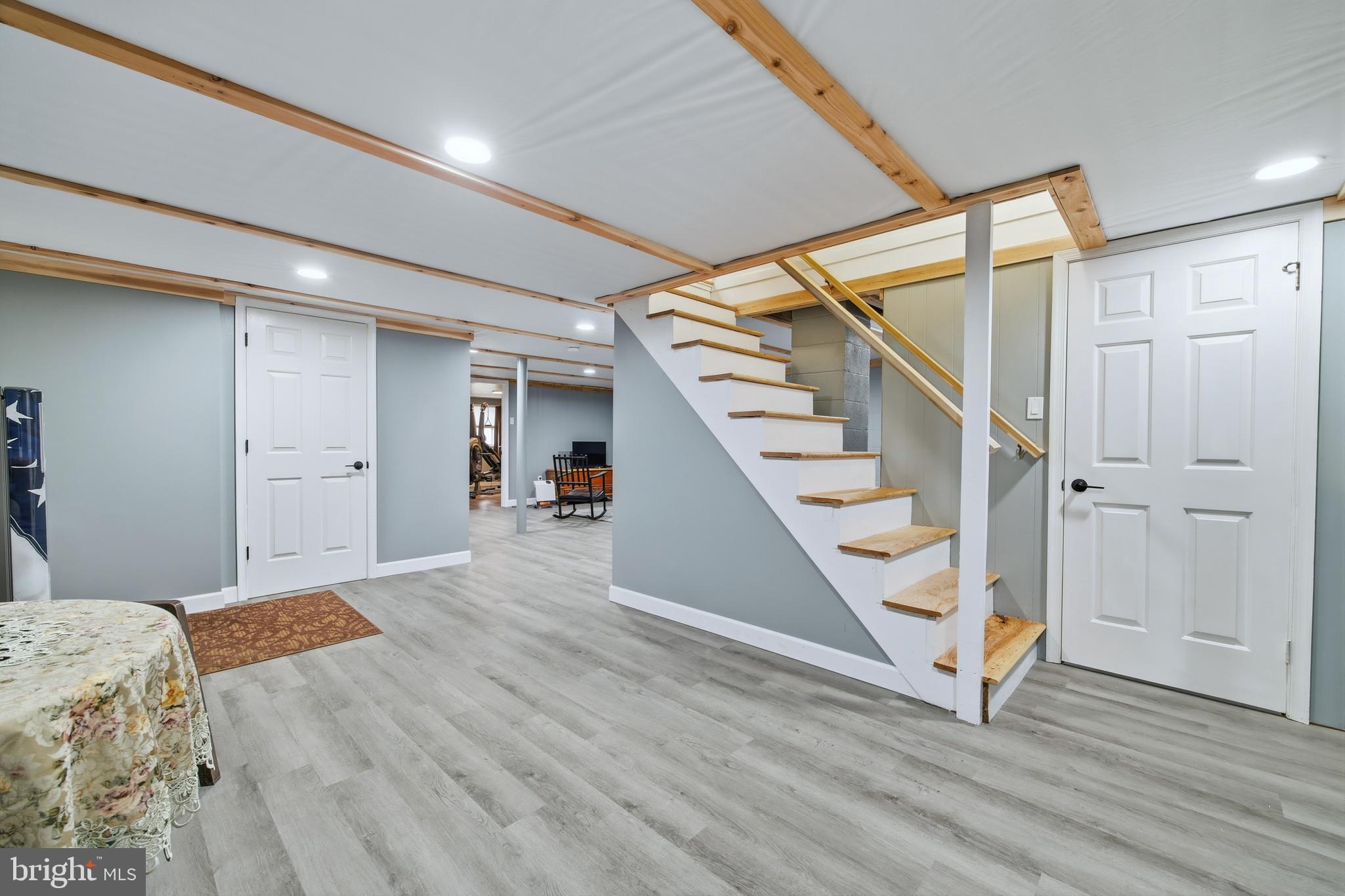 5911 Smith Creek Road New Market, VA 22844 - Photo 46 of 78 a view of an empty room with wooden floor and stairs