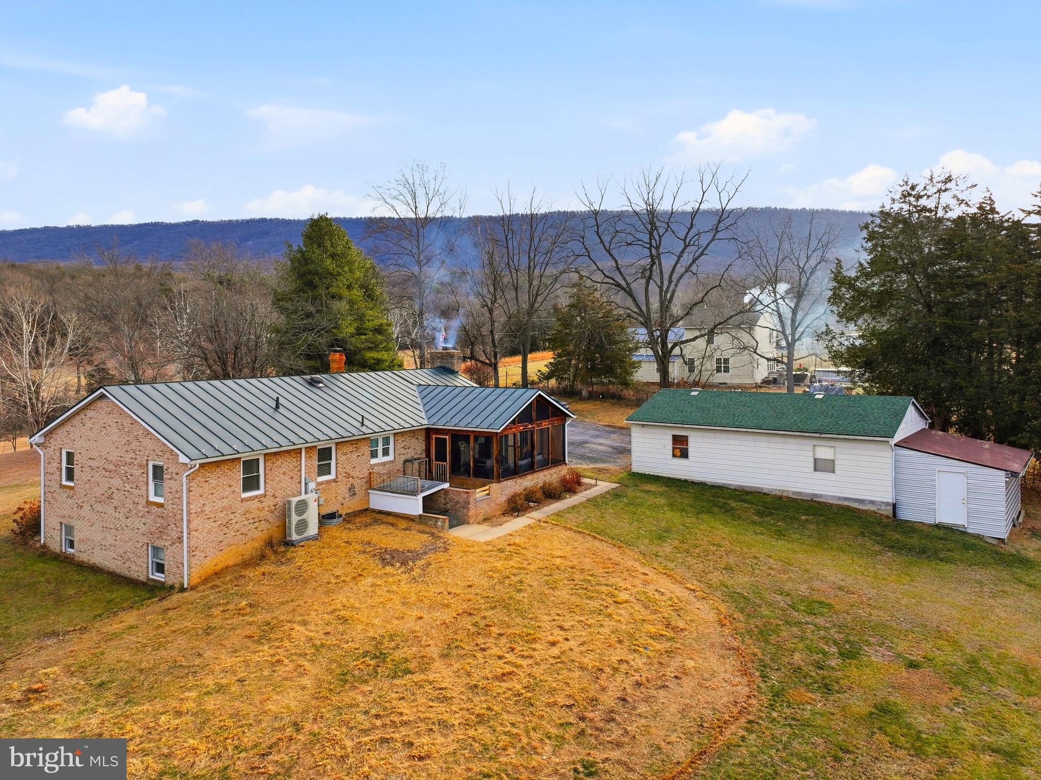5911 Smith Creek Road New Market, VA 22844 - Photo 5 of 78 a view of a house with a yard and sitting area