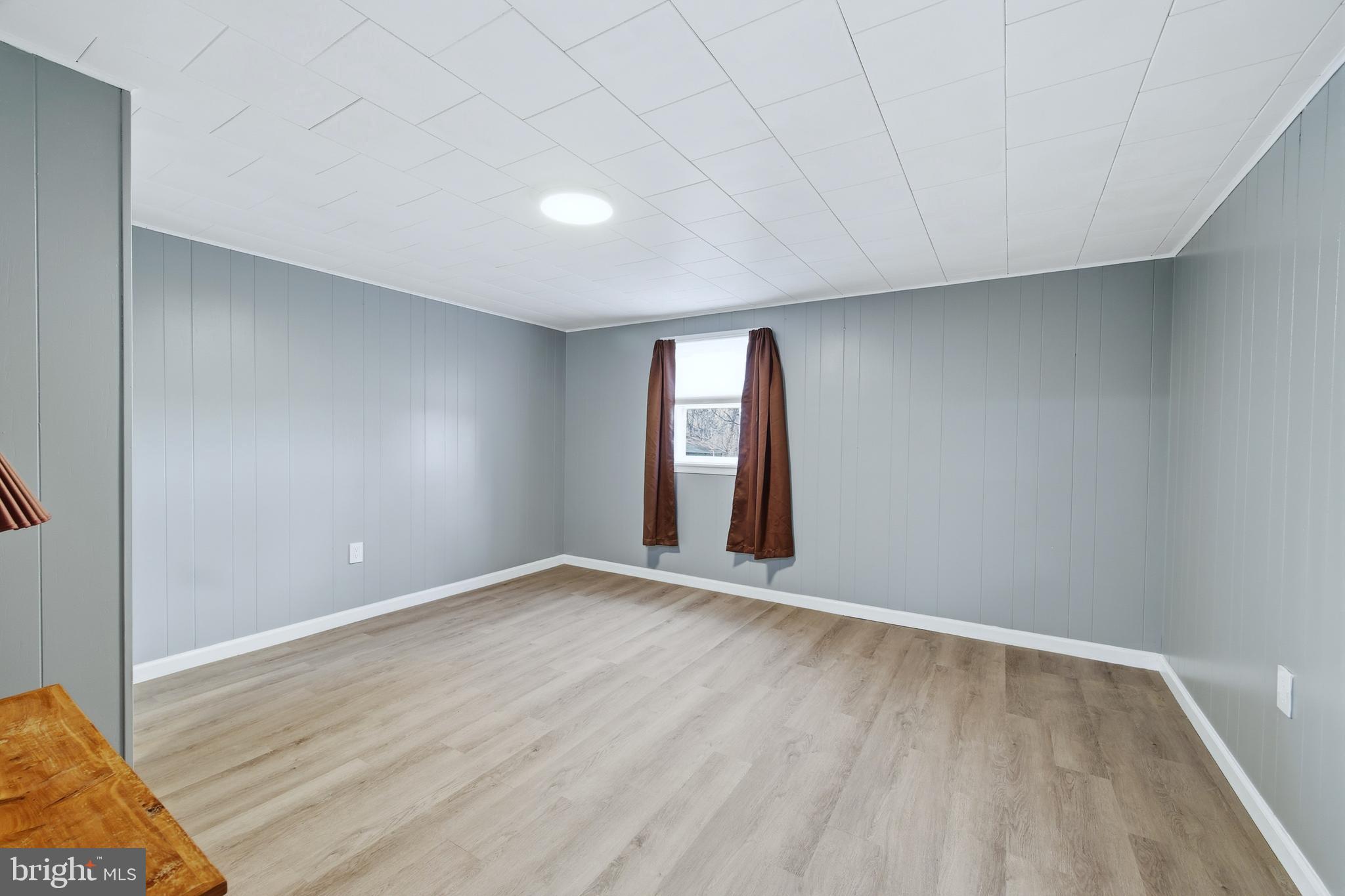 5911 Smith Creek Road New Market, VA 22844 - Photo 51 of 78 a view of an empty room with wooden floor and a window