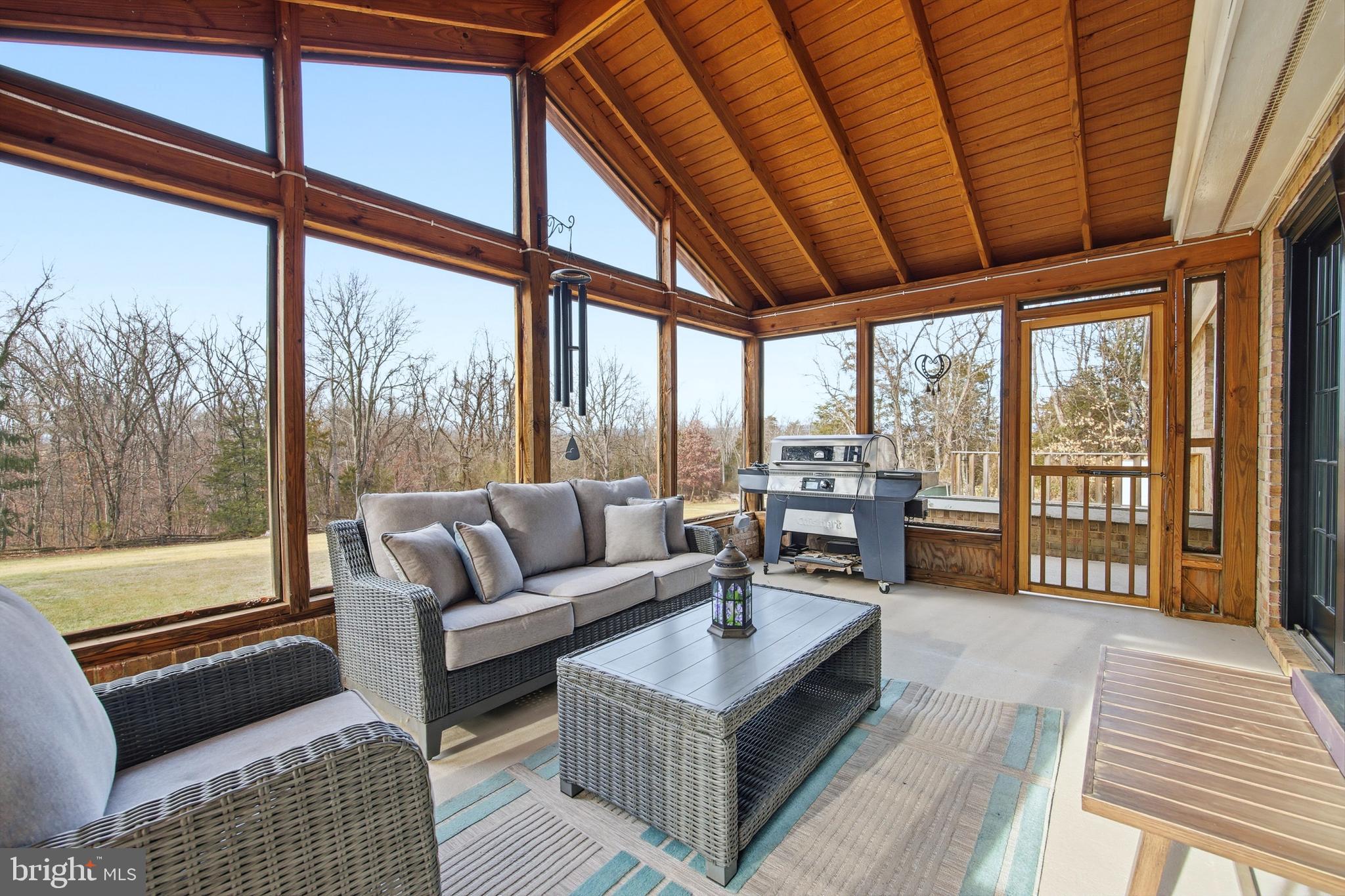 5911 Smith Creek Road New Market, VA 22844 - Photo 78 of 78 a living room with furniture and a floor to ceiling window