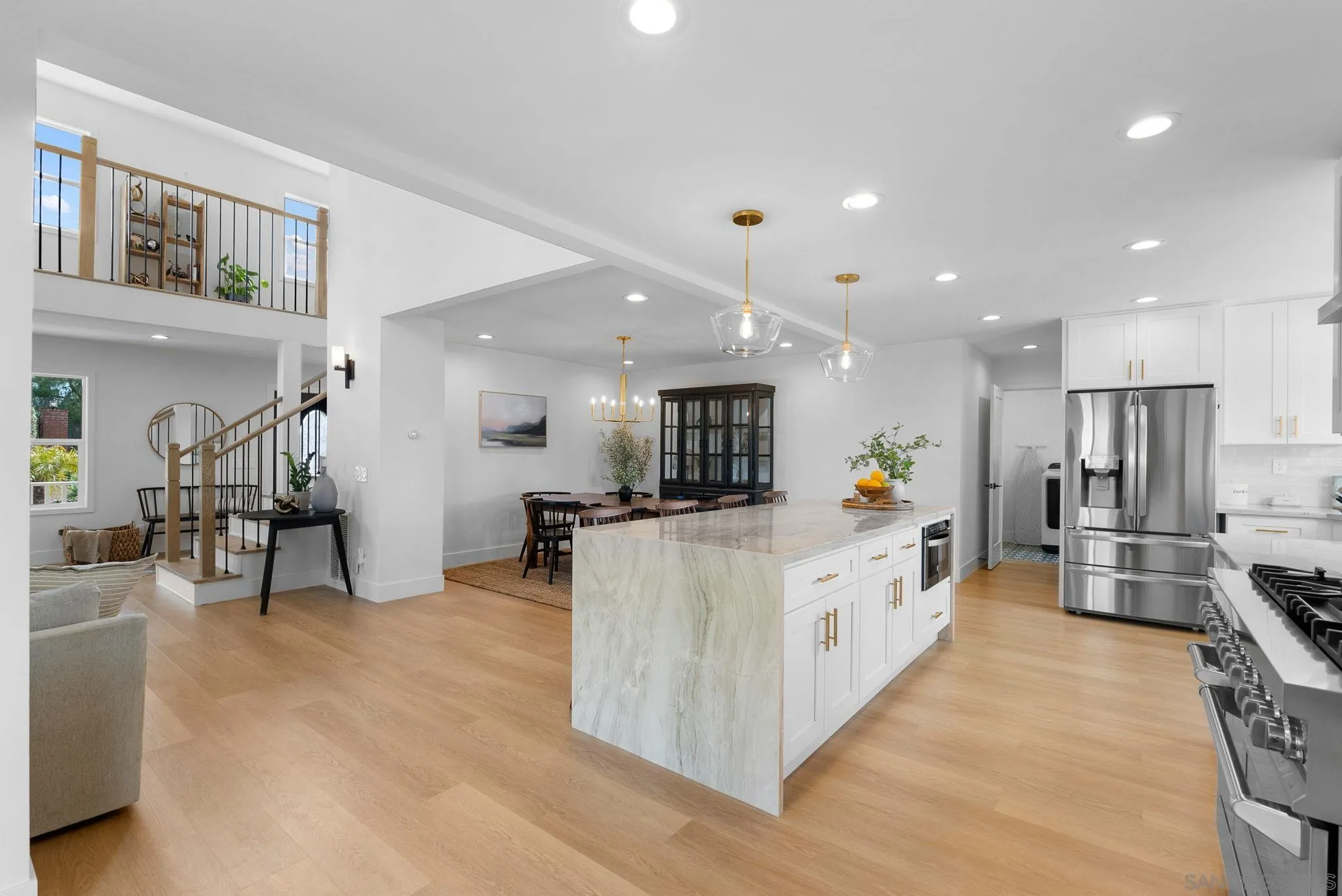 3168 Alta Verde Drive Fallbrook, CA 92028 - Photo 14 of 67 a large white kitchen with lots of counter space and stainless steel appliances
