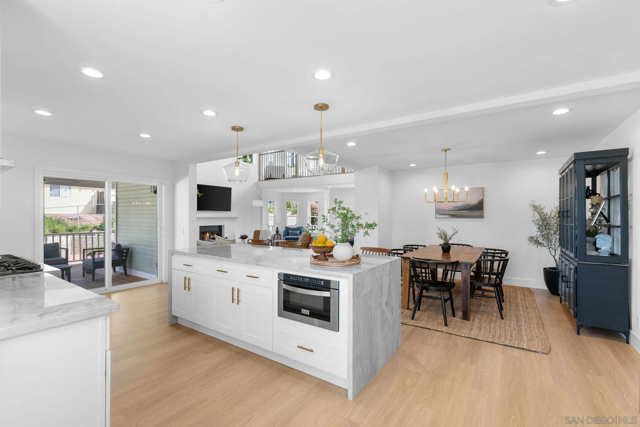 3168 Alta Verde Drive Fallbrook, CA 92028 - Photo 18 of 67 a kitchen that has a lot of cabinets a sink and a stove in it