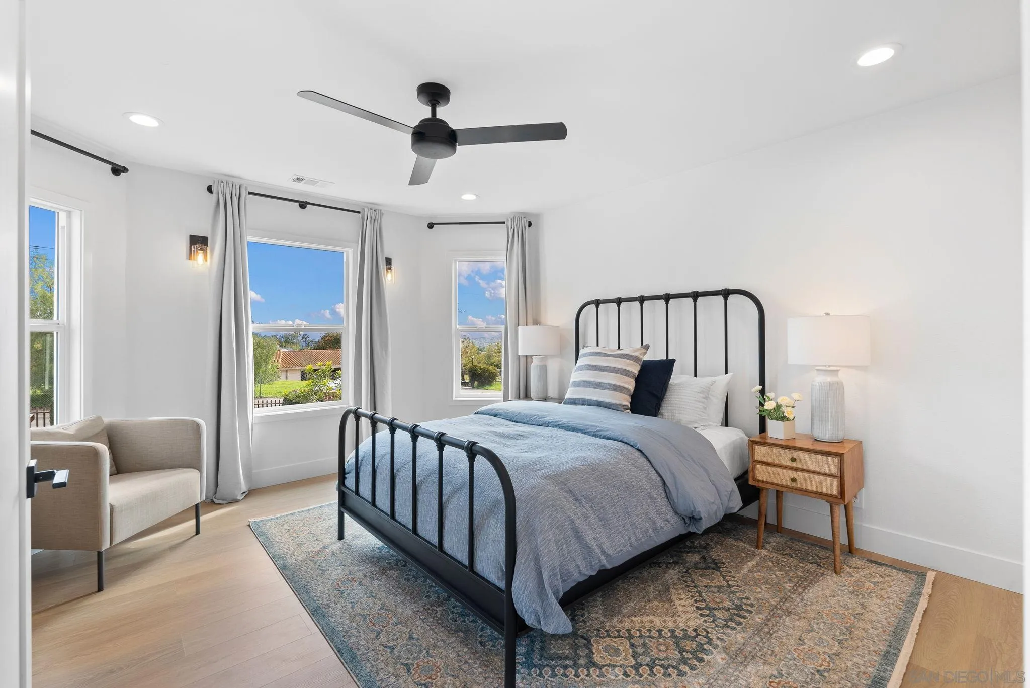 3168 Alta Verde Drive Fallbrook, CA 92028 - Photo 19 of 67 a bedroom with a bed a couch and a window