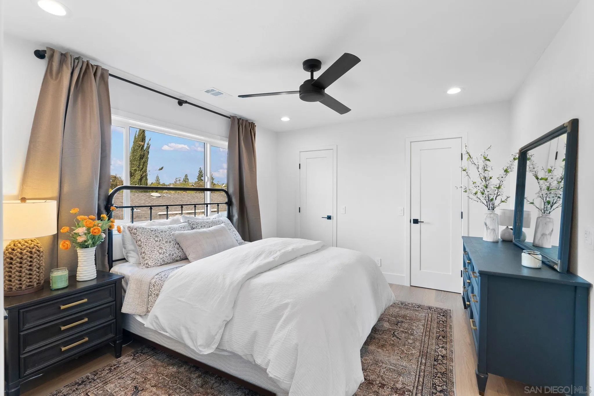 3168 Alta Verde Drive Fallbrook, CA 92028 - Photo 26 of 67 a bedroom with a bed and a flat tv screen