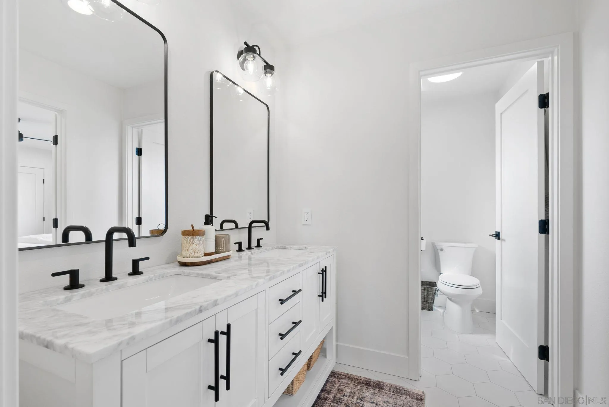 3168 Alta Verde Drive Fallbrook, CA 92028 - Photo 27 of 67 a bathroom with 2 sink and a mirror