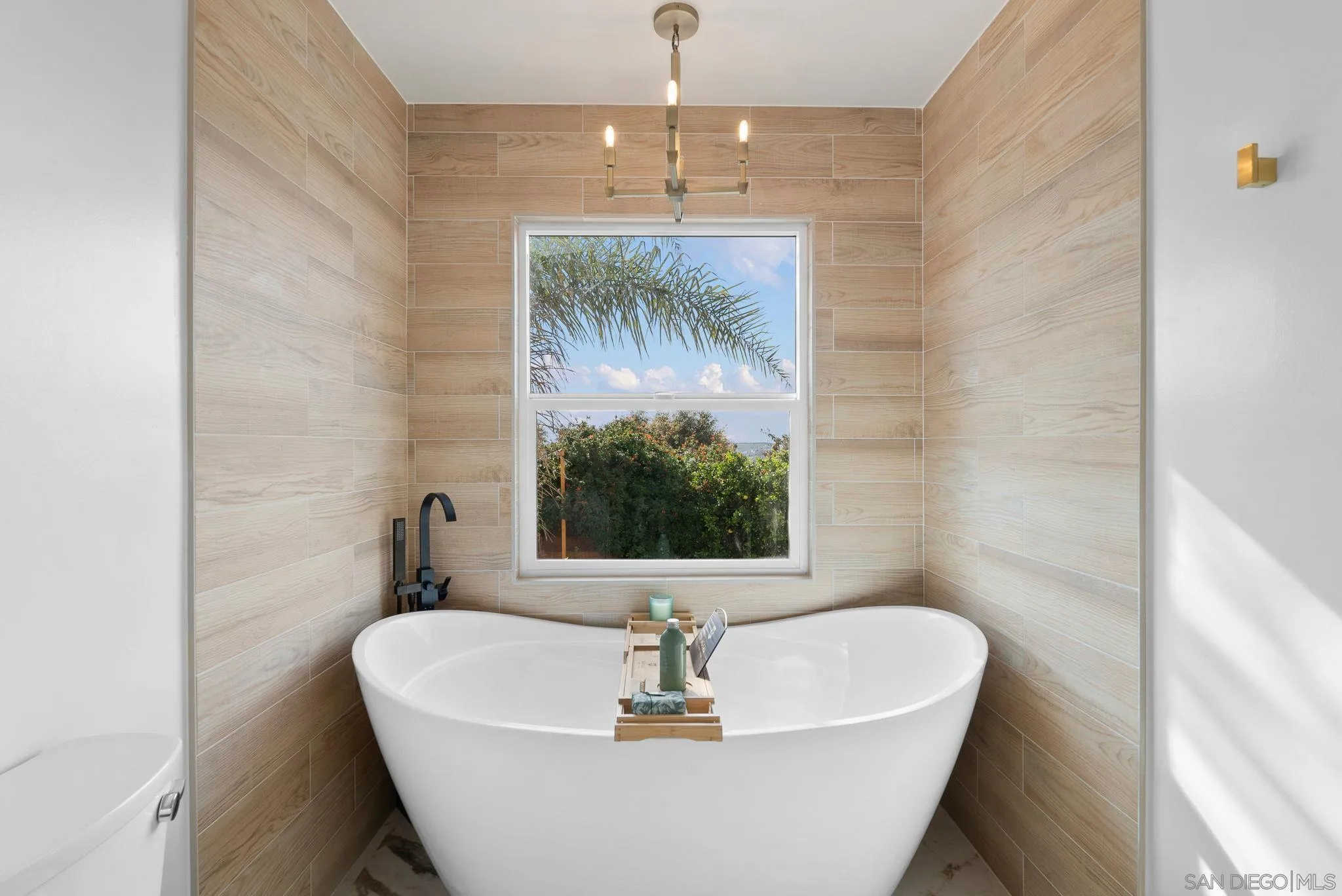 3168 Alta Verde Drive Fallbrook, CA 92028 - Photo 37 of 67 a white bath tub sitting in a bathroom next to a window
