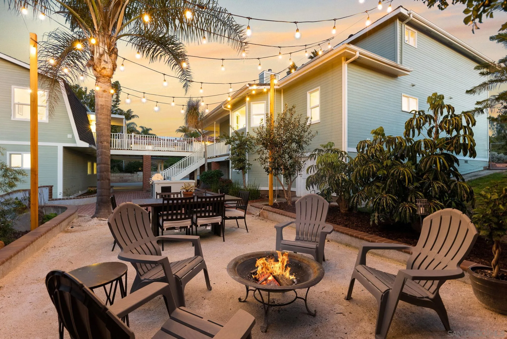 3168 Alta Verde Drive Fallbrook, CA 92028 - Photo 46 of 67 a patio with a table and chairs and potted plants