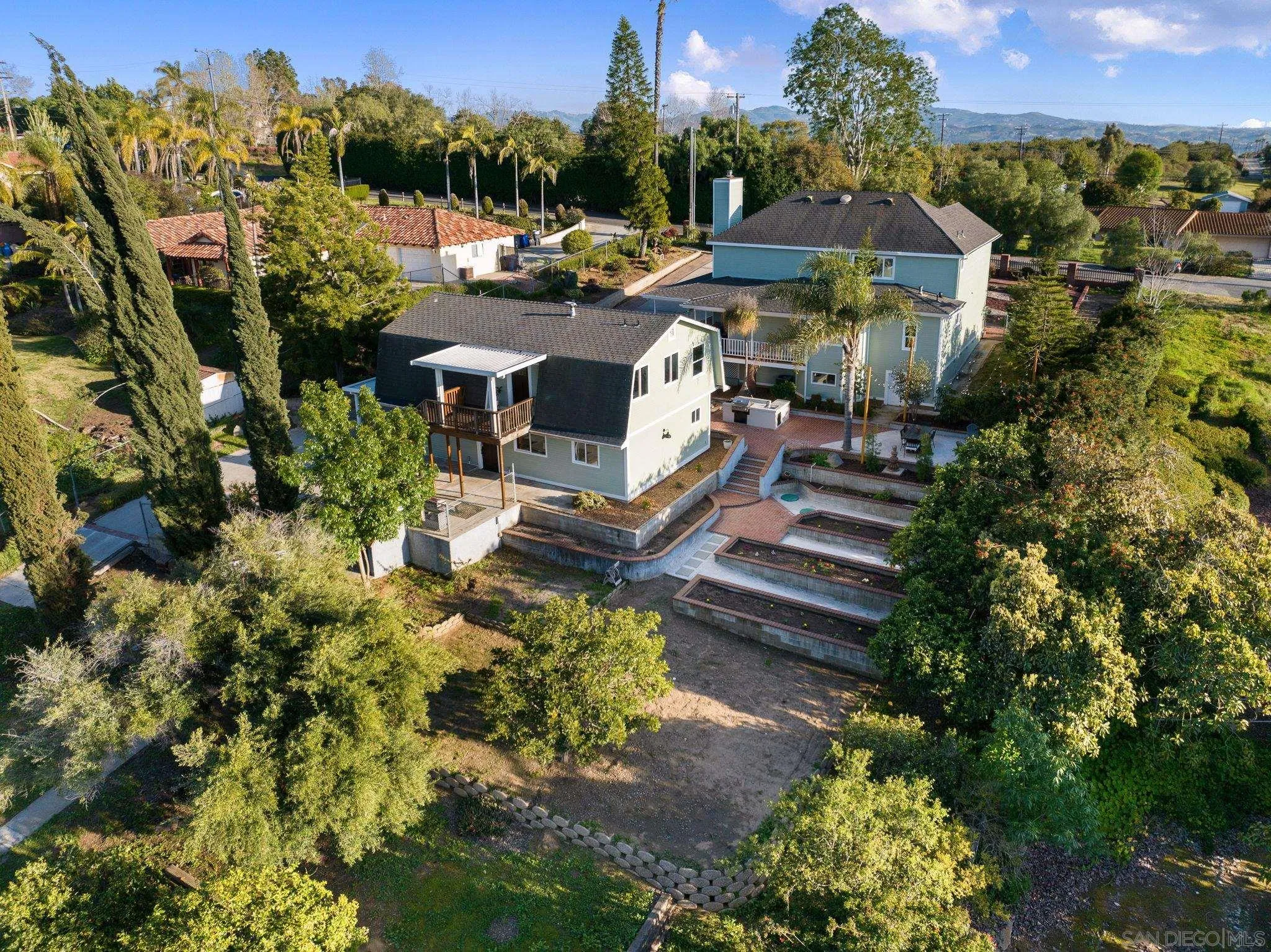 3168 Alta Verde Drive Fallbrook, CA 92028 - Photo 51 of 67 a view of a house with a yard and garden
