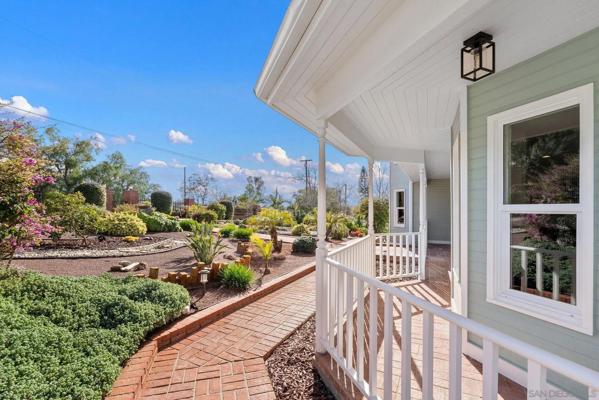 3168 Alta Verde Drive Fallbrook, CA 92028 - Photo 61 of 67 a view of a balcony with couches and wooden floor