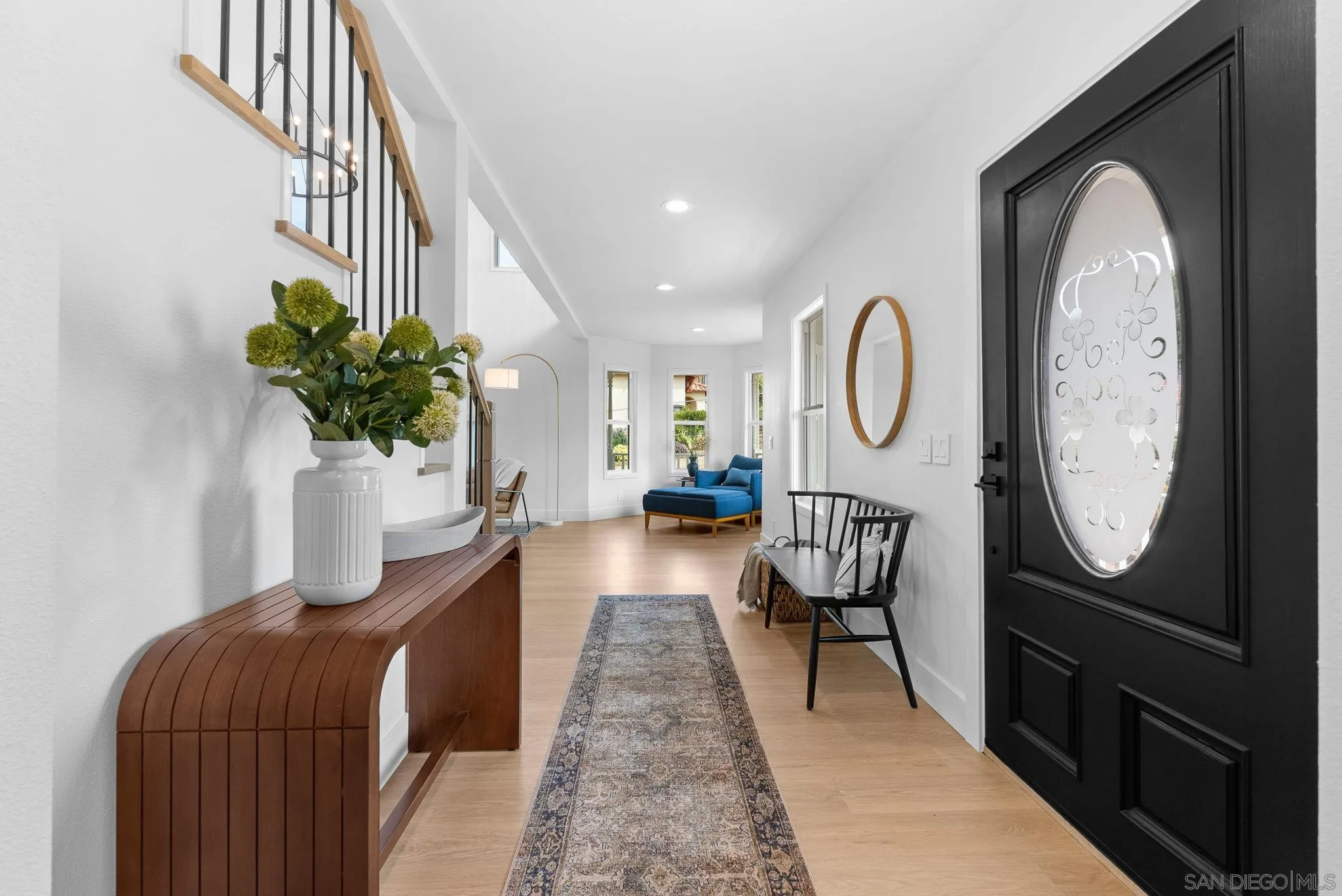 3168 Alta Verde Drive Fallbrook, CA 92028 - Photo 7 of 67 a living room with furniture a mirror and a potted plant