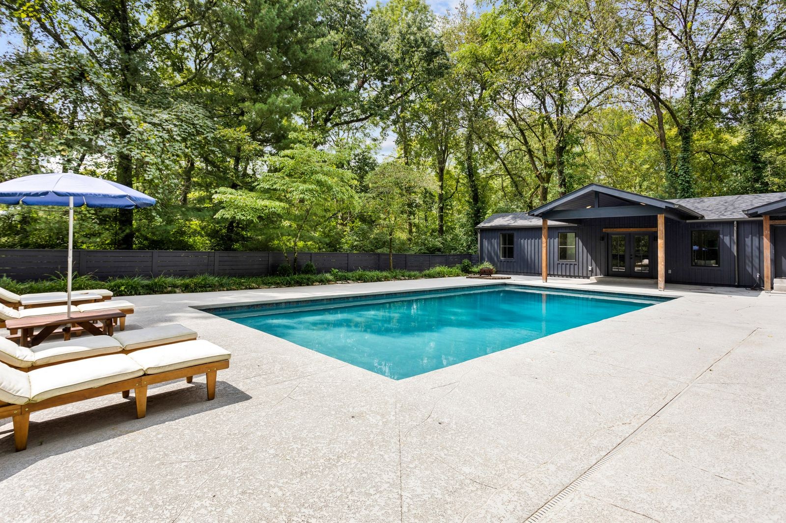 a view of swimming pool with lounge chair
