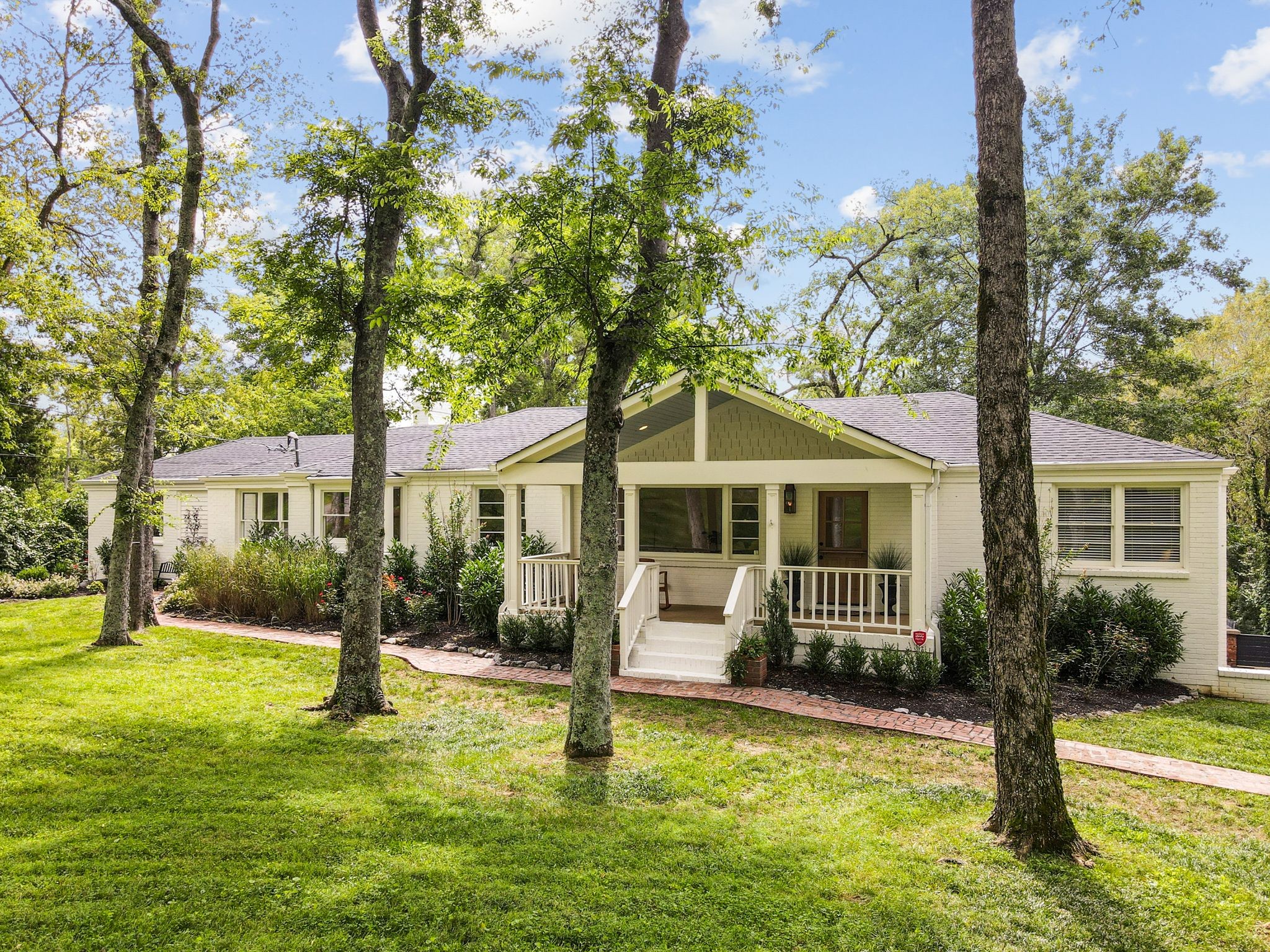 6437 Bresslyn Road Nashville, TN 37205 - Photo 2 of 47 a front view of house with yard and green space