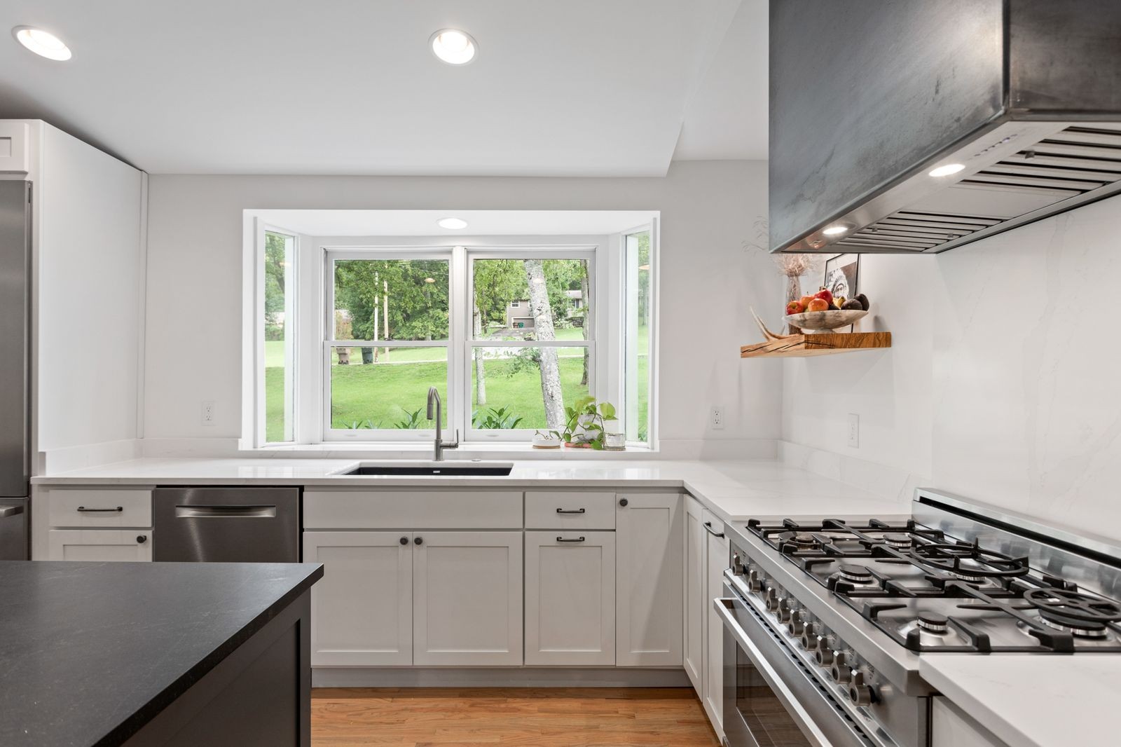 6437 Bresslyn Road Nashville, TN 37205 - Photo 11 of 47 a kitchen with granite countertop a stove and a sink