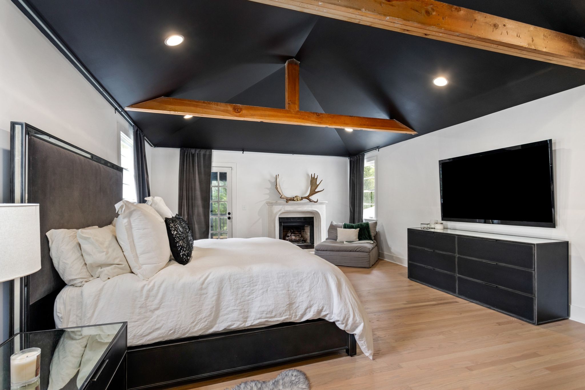 6437 Bresslyn Road Nashville, TN 37205 - Photo 19 of 47 a bedroom with a bed and a flat screen tv