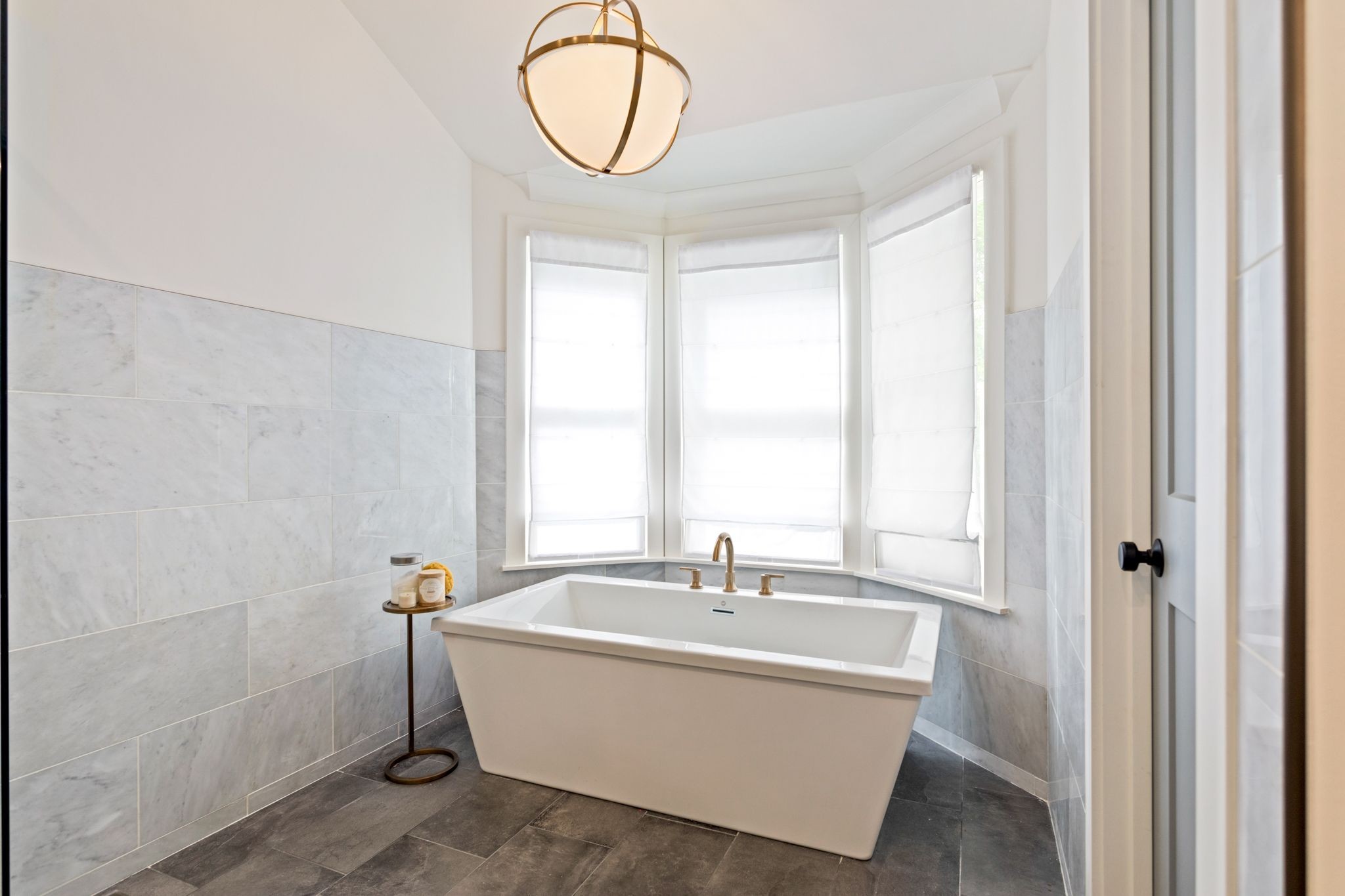 6437 Bresslyn Road Nashville, TN 37205 - Photo 22 of 47 a bathroom with a bathtub a sink and a window