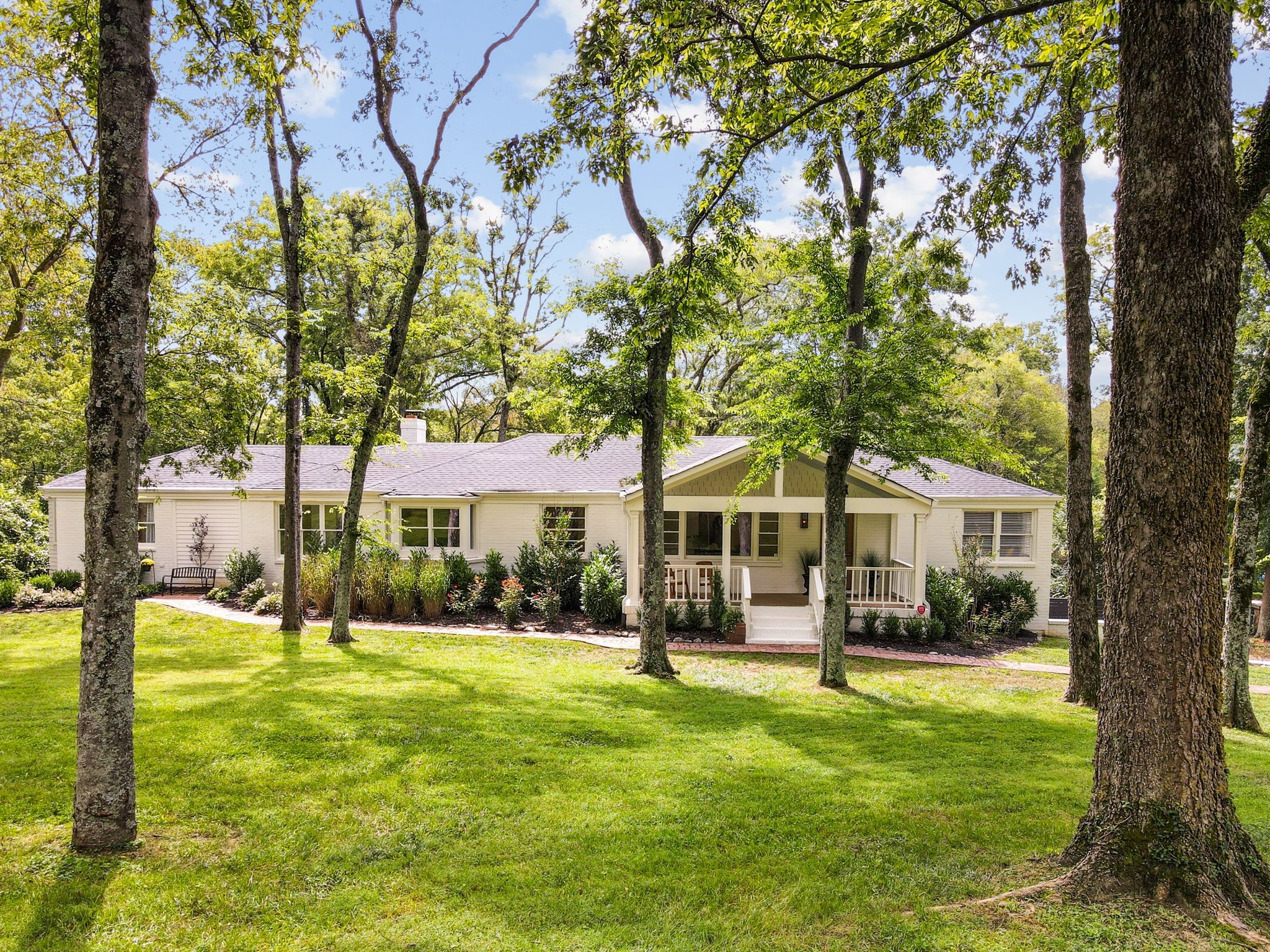 6437 Bresslyn Road Nashville, TN 37205 - Photo 4 of 47 a front view of a house with a yard