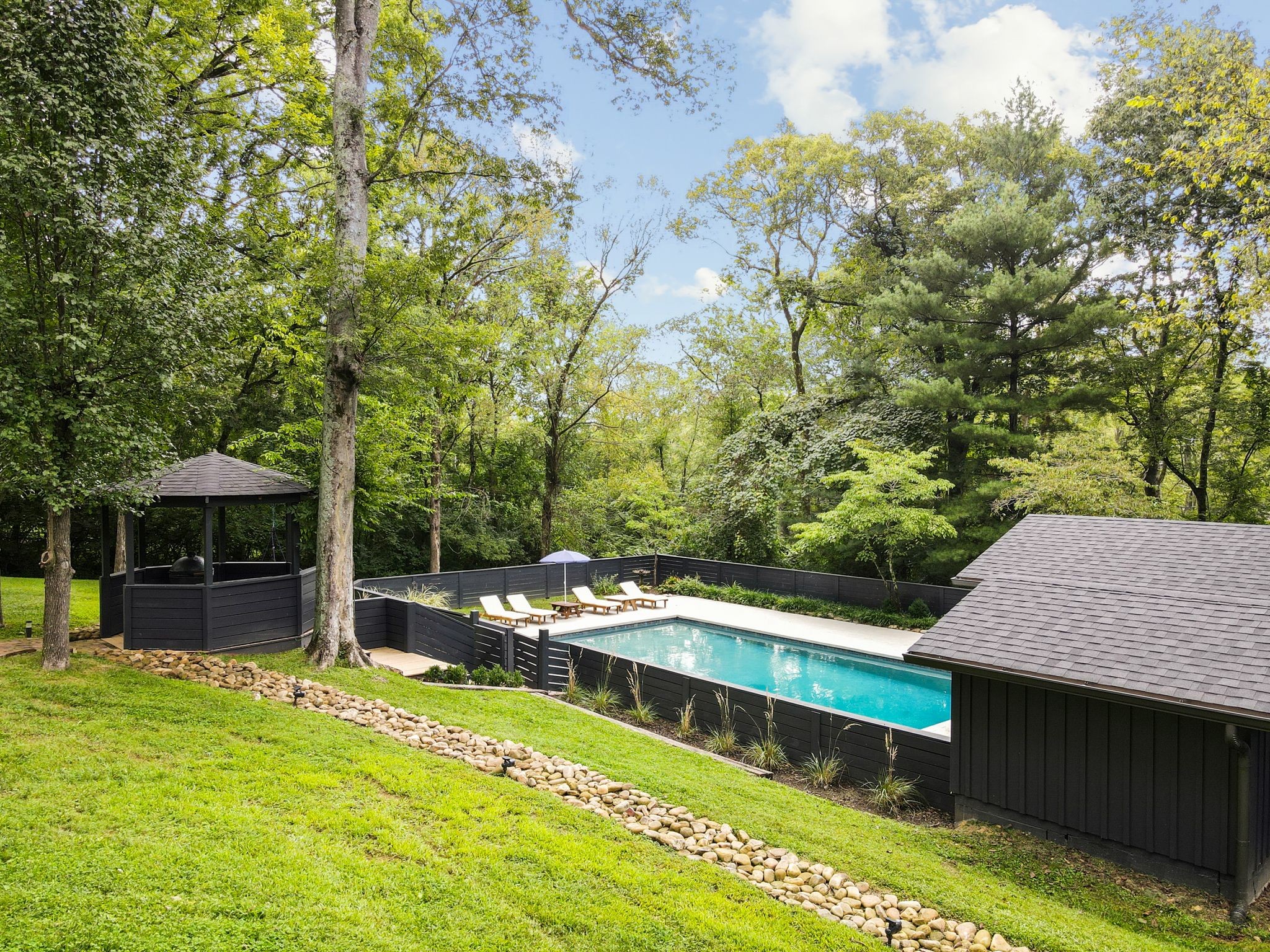 6437 Bresslyn Road Nashville, TN 37205 - Photo 40 of 47 a view of a house with a backyard