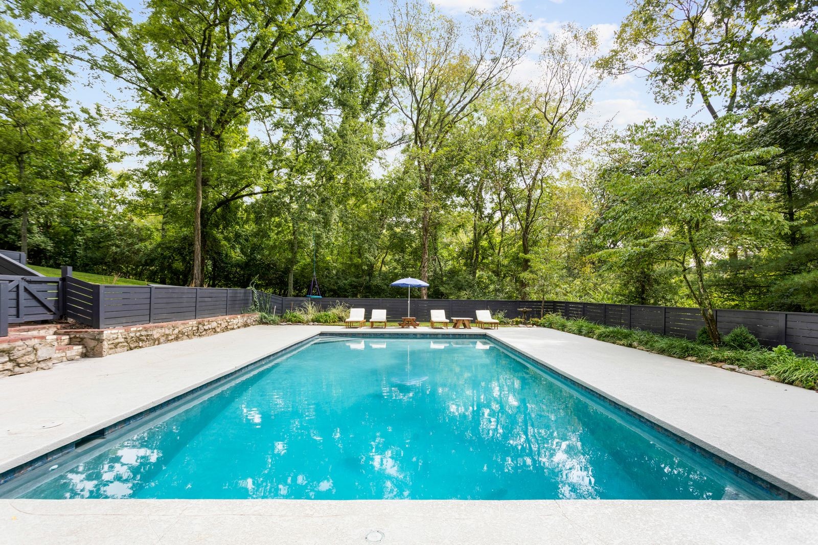 6437 Bresslyn Road Nashville, TN 37205 - Photo 42 of 47 a view of a swimming pool with a chair