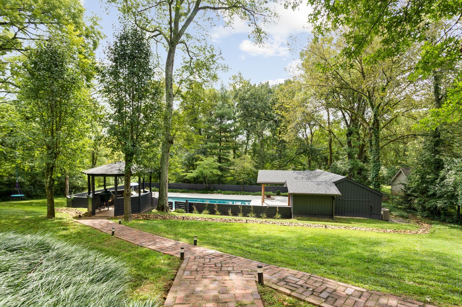 6437 Bresslyn Road Nashville, TN 37205 - Photo 43 of 47 a view of a house with backyard and a tree