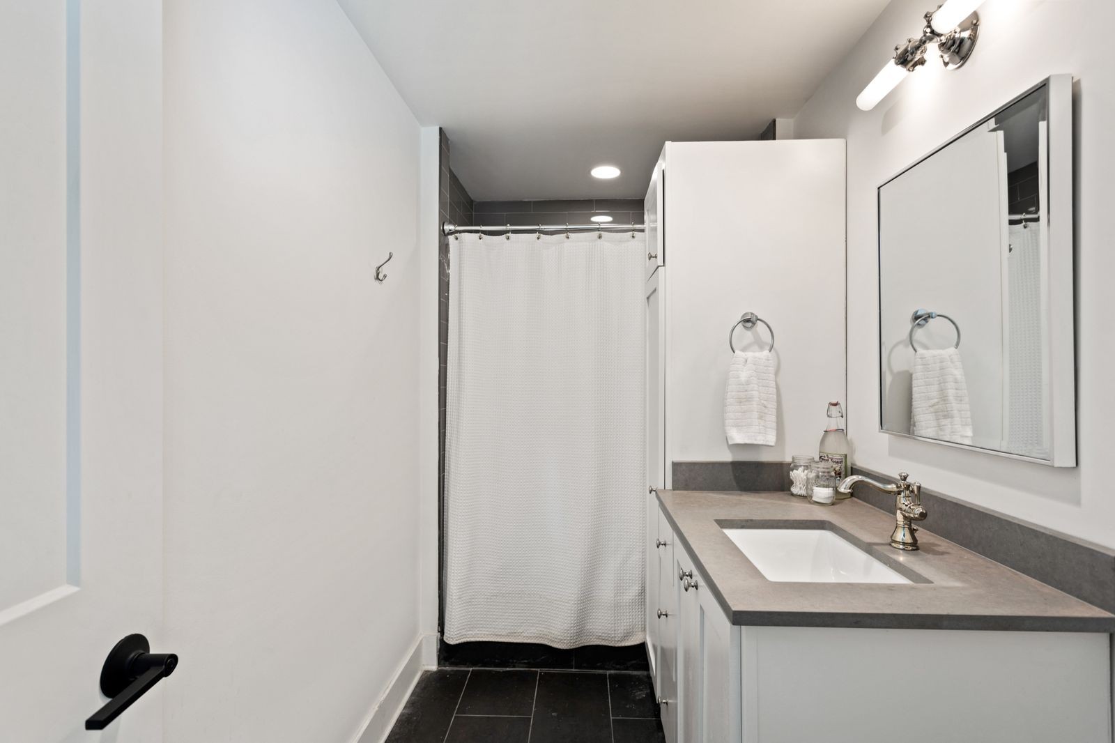 6437 Bresslyn Road Nashville, TN 37205 - Photo 47 of 47 a bathroom with a sink and a mirror