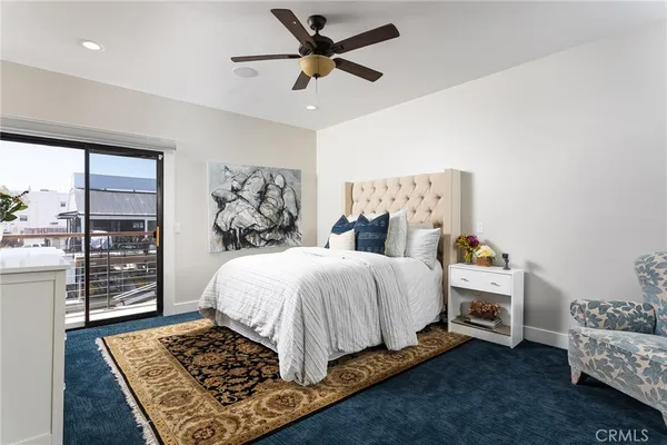 a bedroom with bed and a window