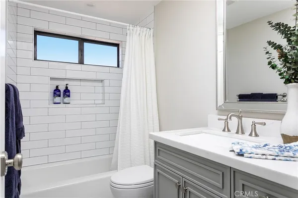 a utility room with sink dryer and washer