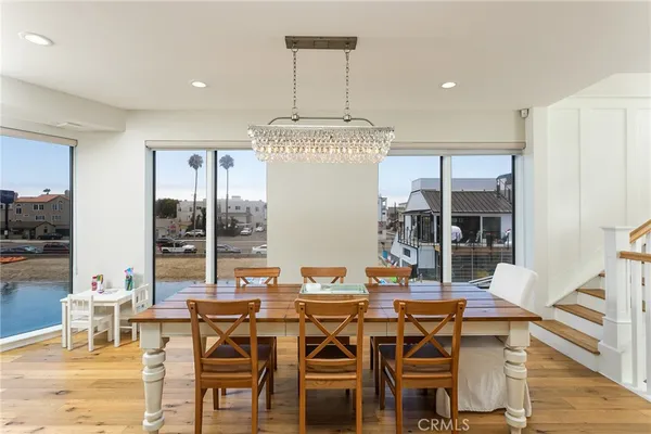 a living room with furniture fireplace and dining table
