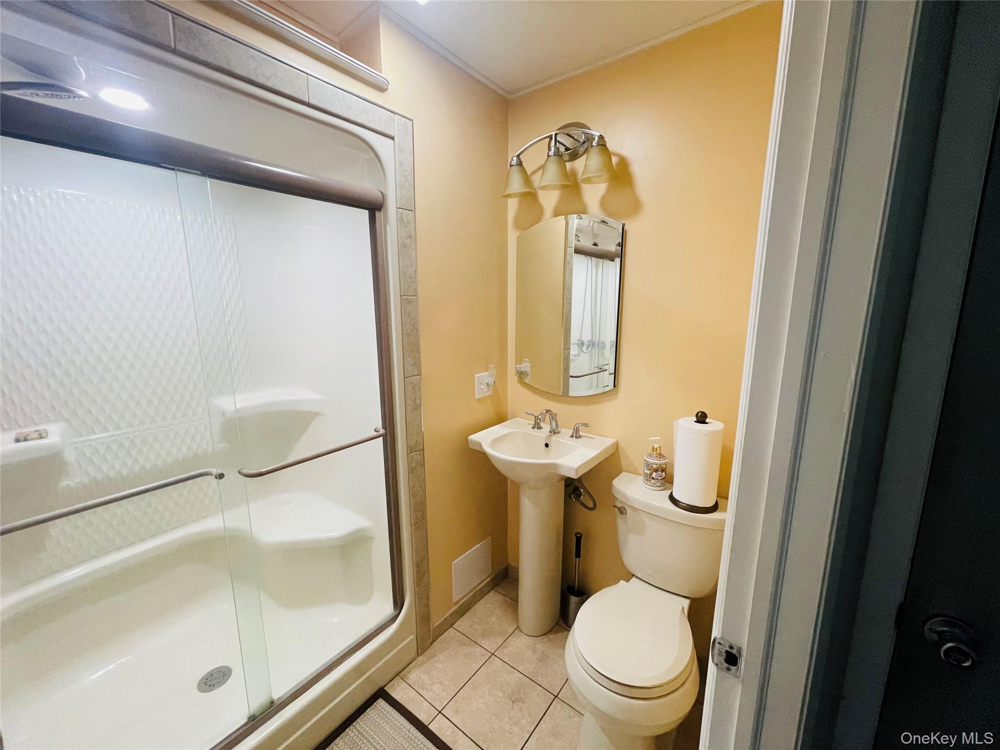 137 Cross Road Goshen, NY 10924 - Photo 10 of 50 a bathroom with a sink and a mirror