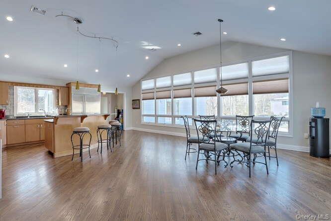 89 Spook Rock Road Suffern, NY 10901 - Photo 12 of 42 an open kitchen with a table and chairs