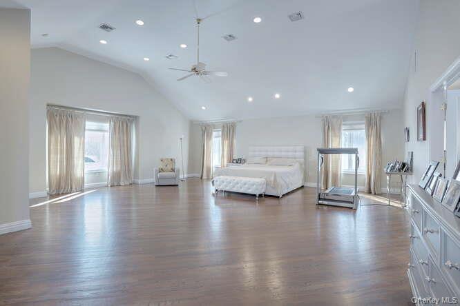 89 Spook Rock Road Suffern, NY 10901 - Photo 19 of 42 a view of an empty room with window and wooden floor