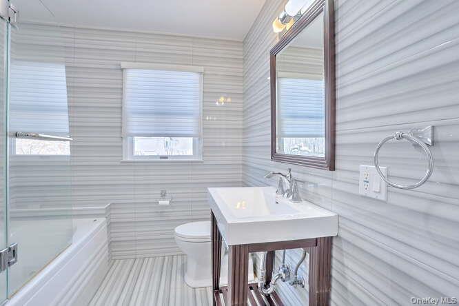 89 Spook Rock Road Suffern, NY 10901 - Photo 25 of 42 a bathroom with a sink a toilet and bathtub