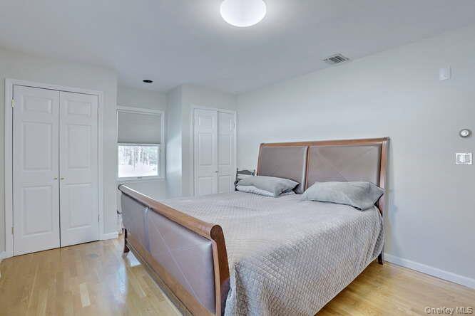 89 Spook Rock Road Suffern, NY 10901 - Photo 26 of 42 a bedroom with a bed and a window