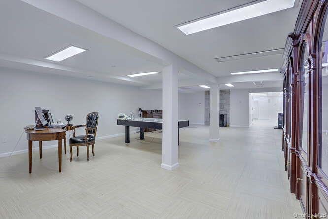 89 Spook Rock Road Suffern, NY 10901 - Photo 30 of 42 a living room with furniture and a table