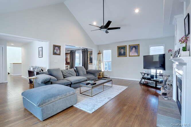 89 Spook Rock Road Suffern, NY 10901 - Photo 6 of 42 a living room with furniture a ceiling fan and a flat screen tv