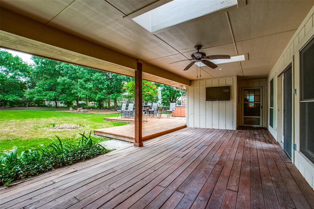 103 Starlite Drive Murphy, TX 75094 - Photo 1 of 1 a view of a livingroom with wooden floor a ceiling fan and stairs