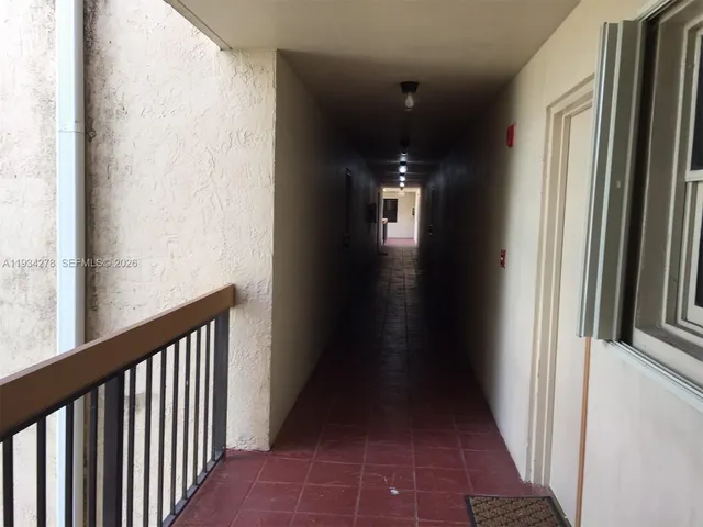 a street sign sitting next to a wooden door