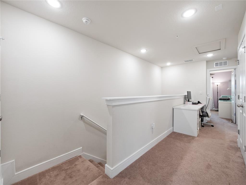 11018 Leafshore Loop Orlando, FL 32829 - Photo 14 of 24 a view of storage and utility room with washer and dryer