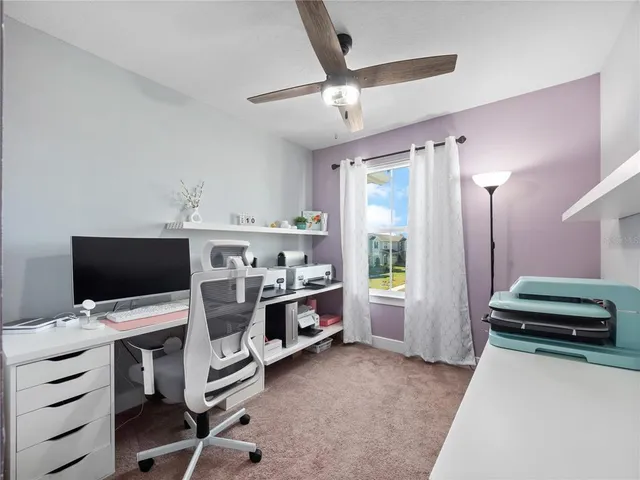 a view of a livingroom with furniture and a flat screen tv