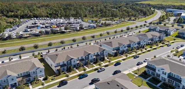 a large swimming pool with outdoor seating and yard