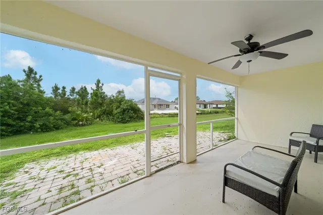 a view of a living room and balcony